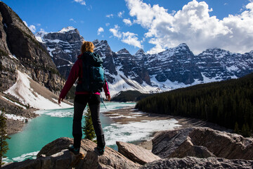 Young woman in Moraine lake, Banff National Park, Canada - obrazy, fototapety, plakaty