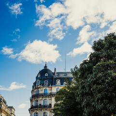 Modernist blue building in a green park on a beautiful sky in a urban scene in Montpellier,