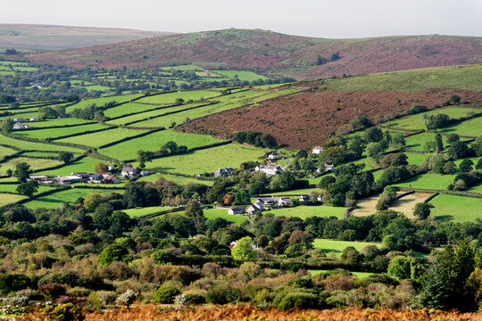Dartmoor National Park landscape near Widecombe aka Widecombe in the Moor village seen from east of Top Tor, Devon England. Farm fields and moorland