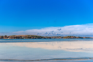 Obraz premium Sea in spring. Beautiful spring landscape with melting ice on blue water of sea