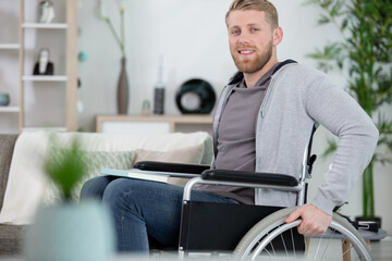 disabled man on wheelchair at home
