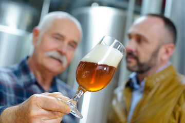 senior man and co-worker in a brewery