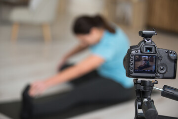 pretty content athletic woman making a video for her blog