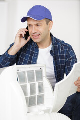 Naklejka na ściany i meble a male technician on the phone