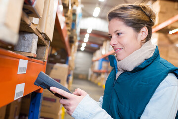 warehouse management system worker with barcode scanner