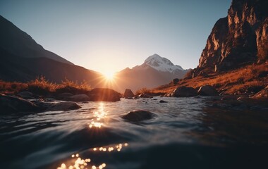 Serene Sunset Over Snow-Capped Mountain Range With Stream