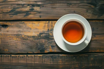 Foto op Plexiglas Cup of tea on wooden table © mbruxelle