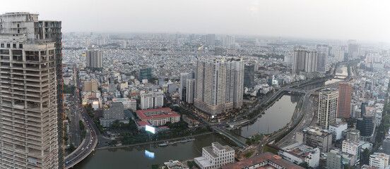 View over Ho Chi Minh City, Vietnam, at dusk, with a lot of air pollution