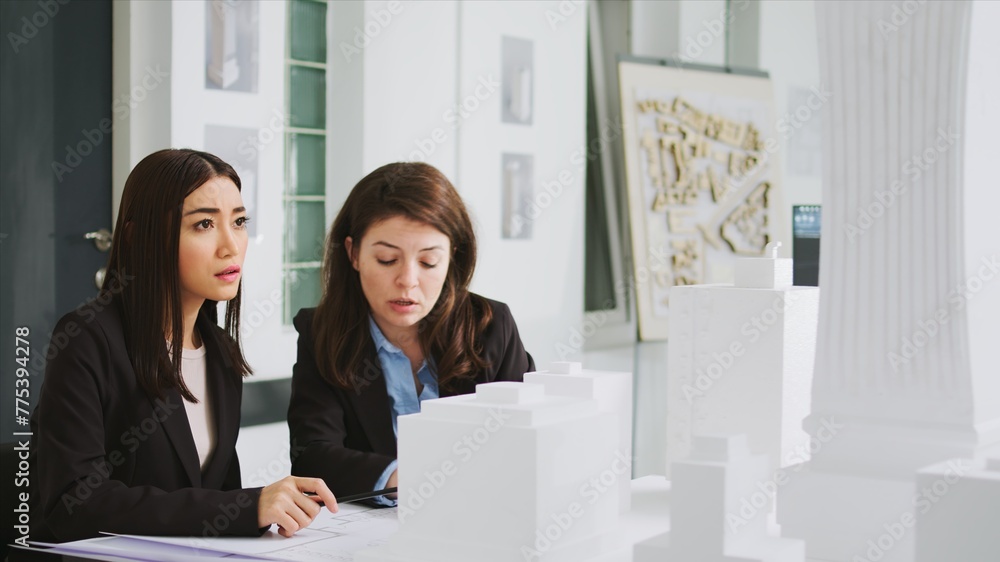 Poster architectural agency workers taking notes on blueprints, calculating real scale measurements to ensu