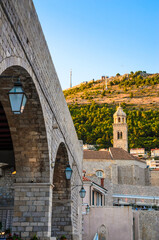 Famous narrow street and old city walls in Dubrovnik, Croatia - 775395016