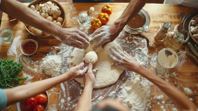 Hands preparing dough on wooden countertop in pizza making class