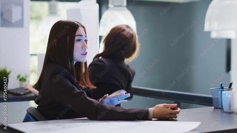 Aufkleber architect chatting with person on hologram in agency office, using visual projection of contractor t