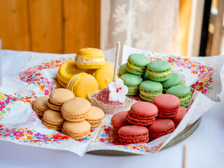Delicious and colorful macarons are offered as a buffet at a party