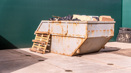 Metal durable industrial trash bin for outdoor trash at construction site. Large waste basket for...