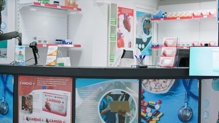 Pharmacy equipped with medicaments packs and bottles, selling dietary supplements and other medicaments. Retail shop with pharmaceutical products and antibiotics on prescription, drugs bottles.