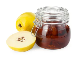 Foto op Canvas Quince jam in glass jar and fresh raw fruits isolated on white © New Africa