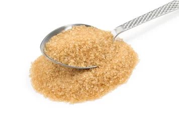 Poster Pile of brown sugar and spoon isolated on white © New Africa