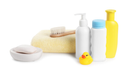 Baby cosmetic products, bath duck, brush and towel isolated on white