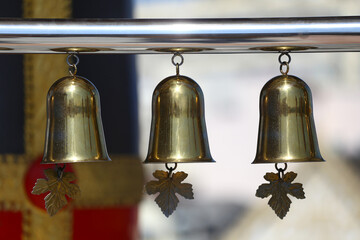 Small golden bell hung for Buddhists. - 775418269