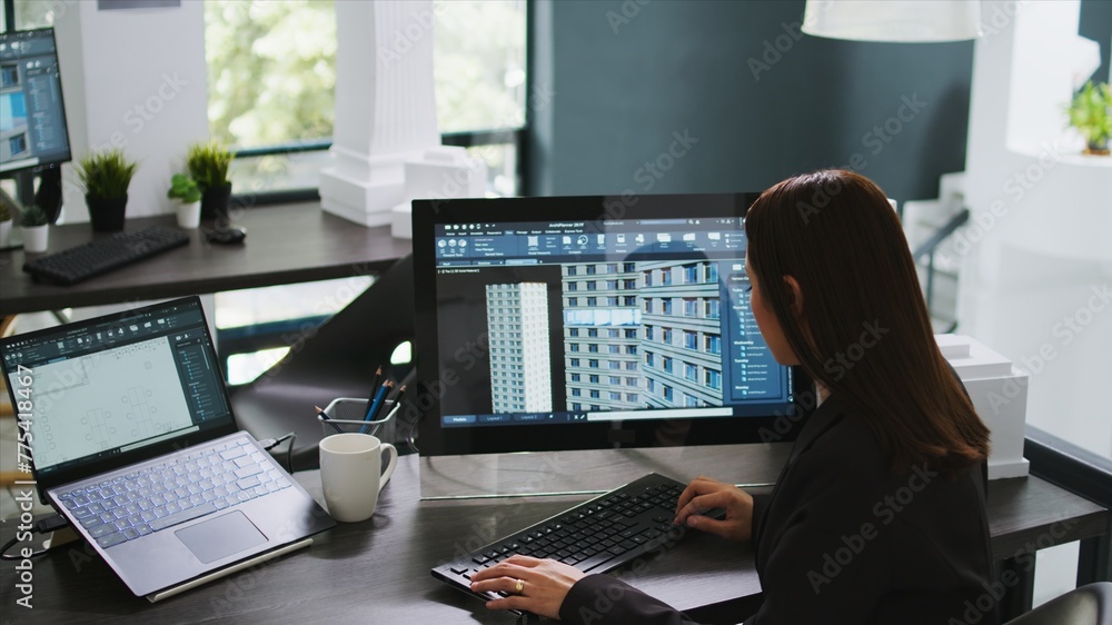 Poster engineer developing 3d building model on graphic software at agency office, creating new real estate