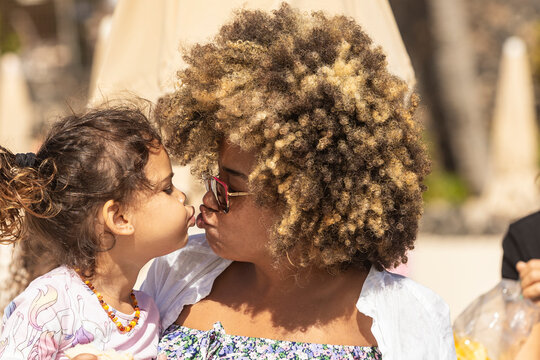 Tender moment between mother and child at the beach
