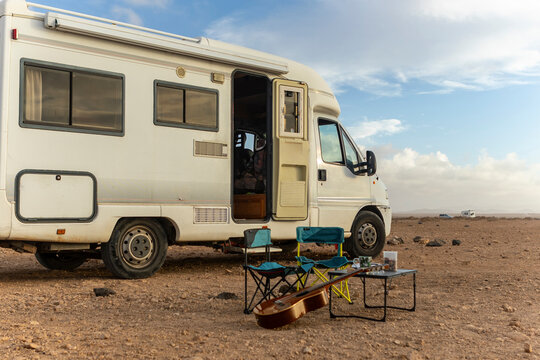 Nomadic Musician Composing by Motorhome Under Open Sky