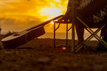 Crop anonymous nomadic Musician's Seaside Inspiration at Sunset