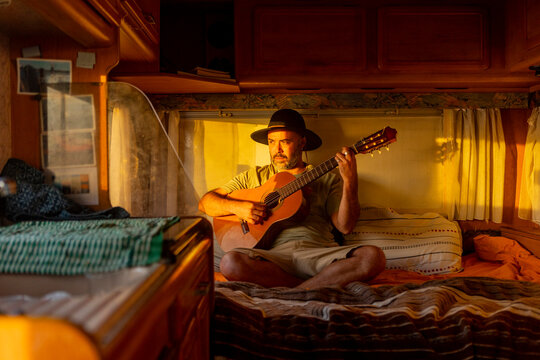 Nomadic Musician Composes in Motorhome at Sunset