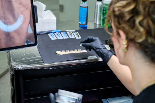 Tattoo artist at work in a modern studio