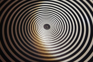 Hypnotic Black and White Spiral Pattern, backdrop. Close-up view of concentric black and white...
