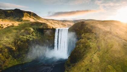 iceland waterfall skogafoss in icelandic nature landscape famous tourist attractions and landmarks destination in icelandic nature landscape on south iceland aerial drone view of top waterfall - obrazy, fototapety, plakaty
