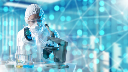 Female laboratory assistant. Scientist works with microscope. Laboratory assistant with test tube...