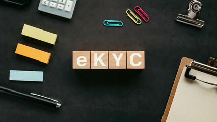 There is wood cube with the word eKYC. It is an abbreviation for electronic Know Your Customer as eye-catching image.