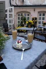 Cake and iced coffe in a cafe on a nice summer day