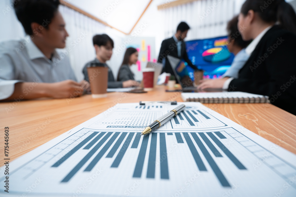Poster focus financial dashboard paper showing graphs and chart with blurred background of diverse business