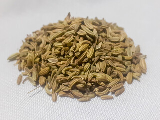 Fennel seeds pile isolated on white background.