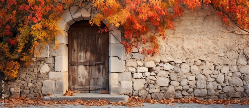 Wall mural stone building featuring a wooden door and a surrounding stone wall, creating a rustic and classic l