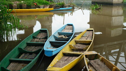 wooden boats anchored on the river