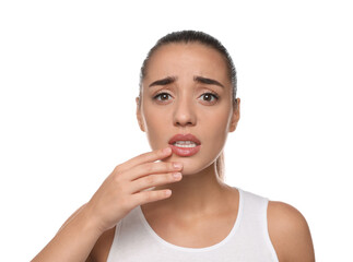 Emotional woman with herpes touching lips on white background