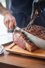 Chef cutting gourmet steak