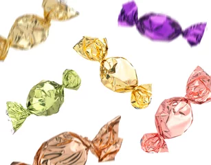  Candies in bright wrappers falling on white background © New Africa