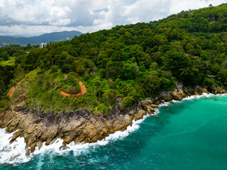 Amazing tropical seashore landscape background,Top view waves crashing on rocks