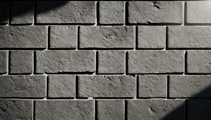Gray brick wall texture with shadows.
