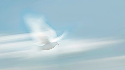A white bird is flying through a clear blue sky