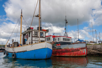 Fishing boats moored in the harbour - obrazy, fototapety, plakaty