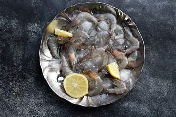 Raw Shrimps on ice cube. Top View. 