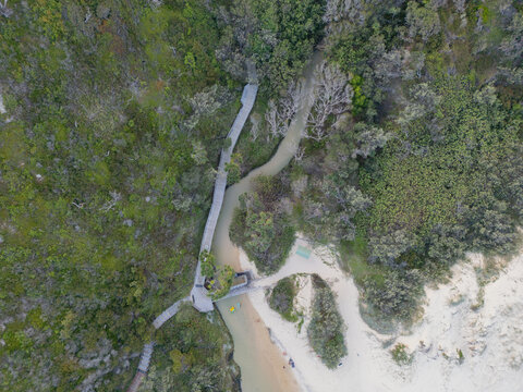 Aerial view of the entrance to Eli Creek along 75 mile beach highway on the sand island of K’gari, Queensland, Australia