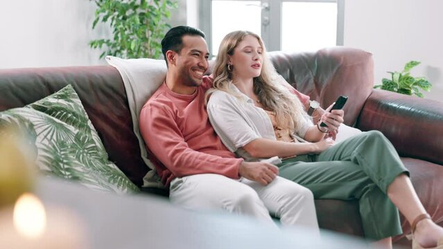 Love, movie or television with couple on sofa in home living room together for subscription entertainment. Smile, watching tv or streaming video with happy young man and woman in apartment to relax
