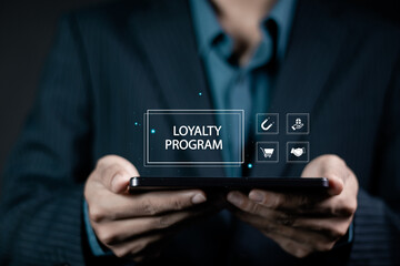 Loyalty program concept for maintaining lasting relationships between brands and customers, Shopping Earn Points Return Money. Businessman showing loyalty program icon on virtual screen.