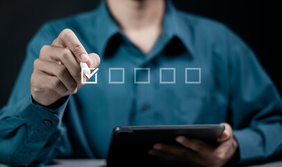 Checklist concept. Checking mark on checkboxes. Businessman  tick correct mark on virtual screen.